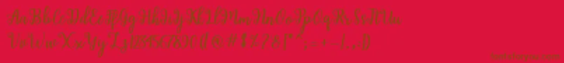 Shaila Script-fontti – ruskeat fontit punaisella taustalla