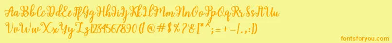 フォントShaila Script – オレンジの文字が黄色の背景にあります。