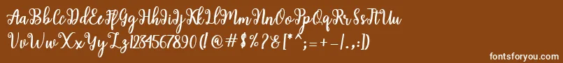 Shaila Script-Schriftart – Weiße Schriften auf braunem Hintergrund