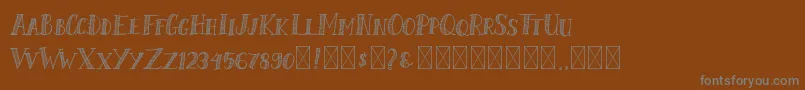 フォントShalmoneHunter – 茶色の背景に灰色の文字