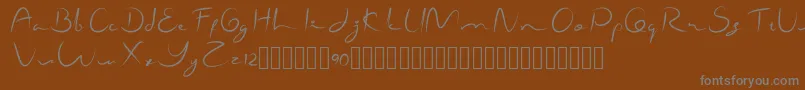 フォントShamallien – 茶色の背景に灰色の文字
