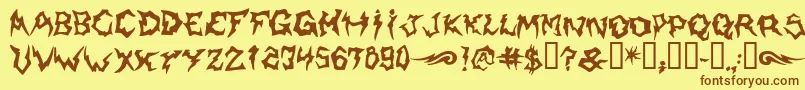 フォントShaman – 茶色の文字が黄色の背景にあります。