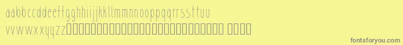 sharik-fontti – harmaat kirjasimet keltaisella taustalla