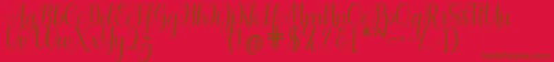 Shedaytia-Schriftart – Braune Schriften auf rotem Hintergrund