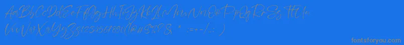 Sheenaz-fontti – harmaat kirjasimet sinisellä taustalla