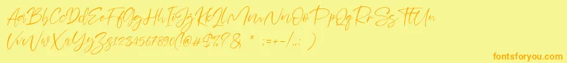 フォントSheenaz – オレンジの文字が黄色の背景にあります。