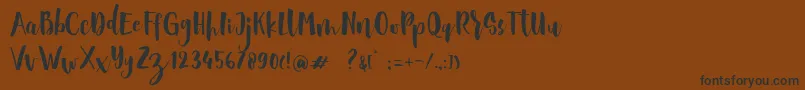 Sheiloria Brush Script Font – Black Fonts on Brown Background