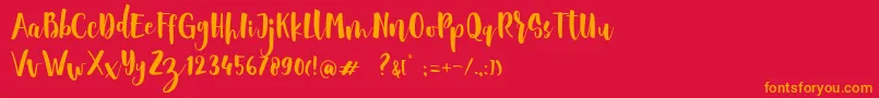 フォントSheiloria Brush Script – 赤い背景にオレンジの文字