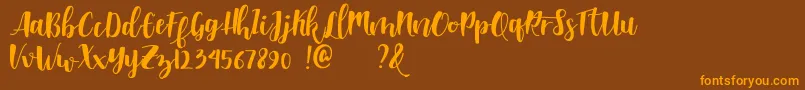 Shella clean dafont Font – Orange Fonts on Brown Background