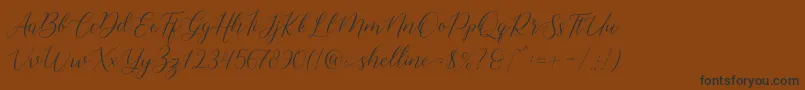 shelline Font – Black Fonts on Brown Background