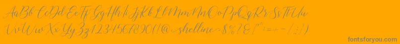 Fonte shelline – fontes cinzas em um fundo laranja