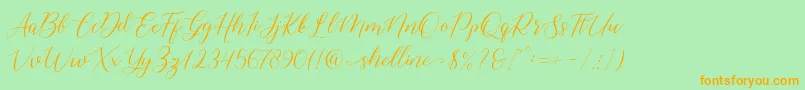 shelline-Schriftart – Orangefarbene Schriften auf grünem Hintergrund
