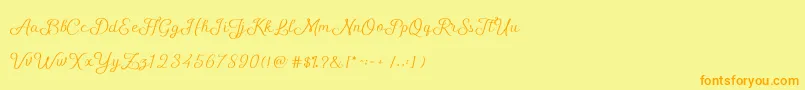 フォントShellyScript – オレンジの文字が黄色の背景にあります。