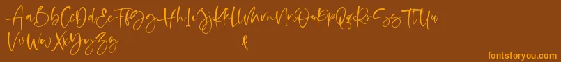 Shelma and Hugie Font – Orange Fonts on Brown Background