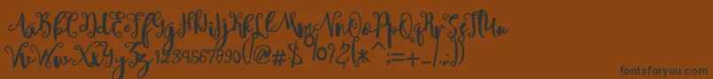 sheyna-Schriftart – Schwarze Schriften auf braunem Hintergrund