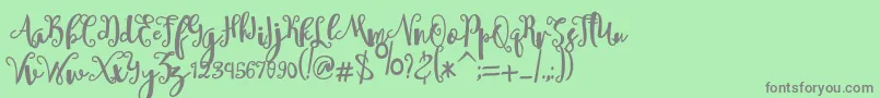 sheyna Font – Gray Fonts on Green Background