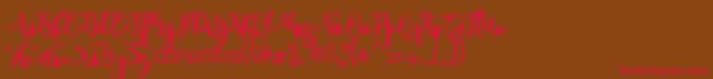 sheyna-Schriftart – Rote Schriften auf braunem Hintergrund