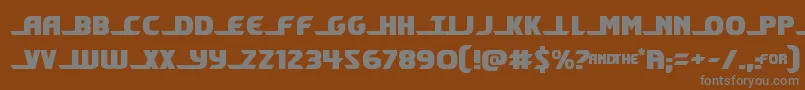 shiningherald-fontti – harmaat kirjasimet ruskealla taustalla