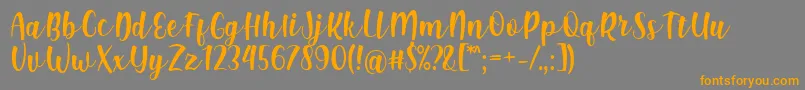 Shink Font by Rifki 7NTypes Font – Orange Fonts on Gray Background