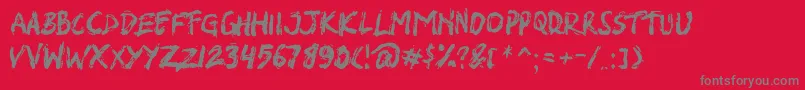 フォントSHIRK – 赤い背景に灰色の文字