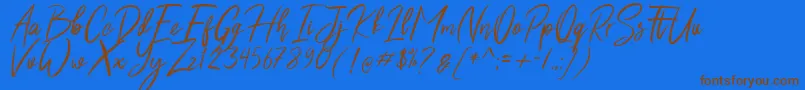 フォントShutten Reason Free – 茶色の文字が青い背景にあります。