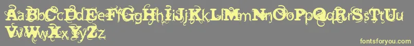 Шрифт VtksWineLabelTwo – жёлтые шрифты на сером фоне