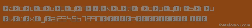 CancranacancarnacaReduxSans-Schriftart – Graue Schriften auf braunem Hintergrund