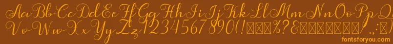 フォントSimphony – オレンジ色の文字が茶色の背景にあります。