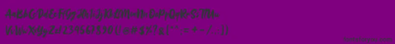 フォントSinestta – 紫の背景に黒い文字