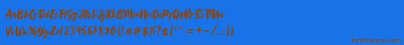 Sinestta Font – Brown Fonts on Blue Background