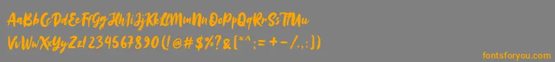 Sinestta Font – Orange Fonts on Gray Background
