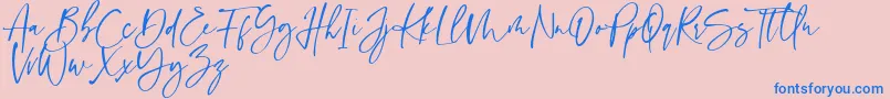 Sinthya-Schriftart – Blaue Schriften auf rosa Hintergrund