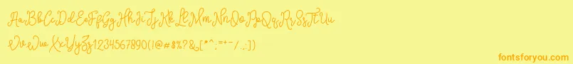 SinyakScript-fontti – oranssit fontit keltaisella taustalla
