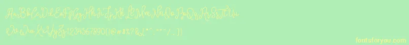 SinyakScript Font – Yellow Fonts on Green Background