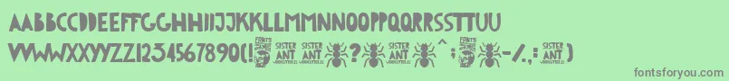 フォントSister Ant – 緑の背景に灰色の文字