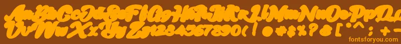Czcionka Skatter Base – pomarańczowe czcionki na brązowym tle