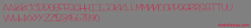 SkinnyStyle-Schriftart – Rote Schriften auf grauem Hintergrund