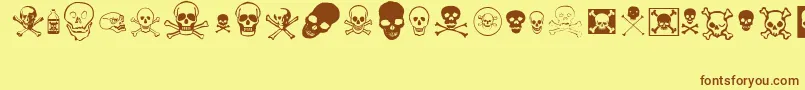 フォントskullz – 茶色の文字が黄色の背景にあります。