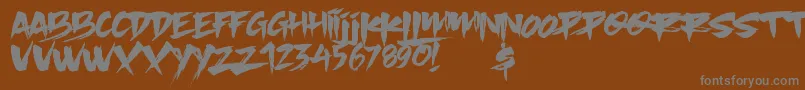Slacker Brush-fontti – harmaat kirjasimet ruskealla taustalla