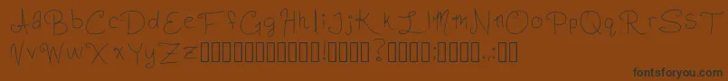 フォントSlightlyCursiveCharacters Regular – 黒い文字が茶色の背景にあります