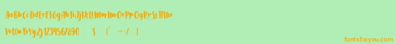 フォントSlow Life – オレンジの文字が緑の背景にあります。