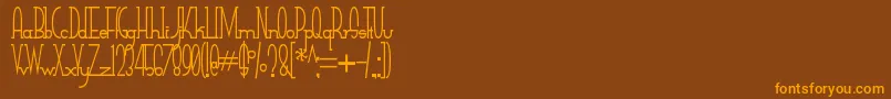 SmallTall-Schriftart – Orangefarbene Schriften auf braunem Hintergrund