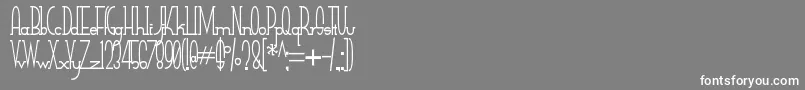 SmallTallフォントについての詳細 フォントSmallTall – 灰色の背景に白い文字