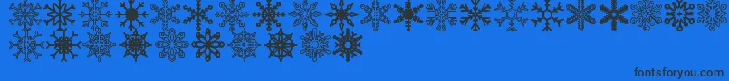 Czcionka Snowflakes St – czarne czcionki na niebieskim tle