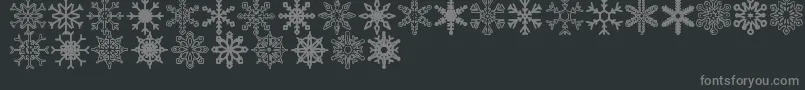 Snowflakes St-fontti – harmaat kirjasimet mustalla taustalla