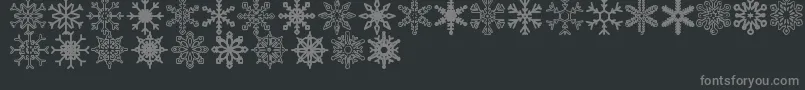 Fonte Snowflakes St – fontes cinzas em um fundo preto