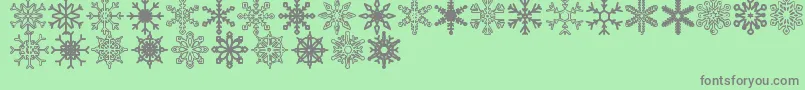 Snowflakes St-Schriftart – Graue Schriften auf grünem Hintergrund