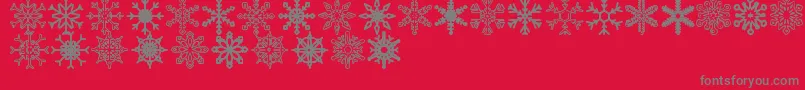 Fonte Snowflakes St – fontes cinzas em um fundo vermelho