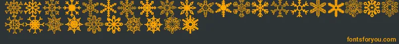 Snowflakes St-fontti – oranssit fontit mustalla taustalla