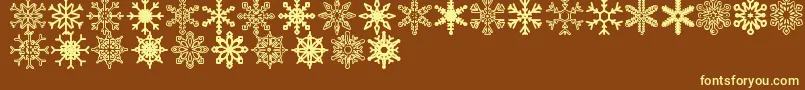 Fonte Snowflakes St – fontes amarelas em um fundo marrom